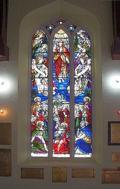 tained glass window surrounded by memorial plaques, Christ Church, Simla