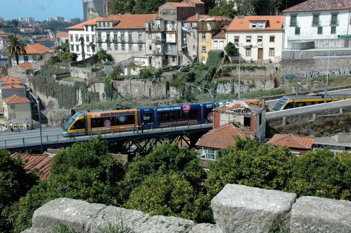 A Subway train about to cross an iron bridge across the Douro River, Portugal