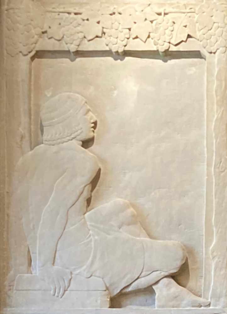 A labourer watching on the left
