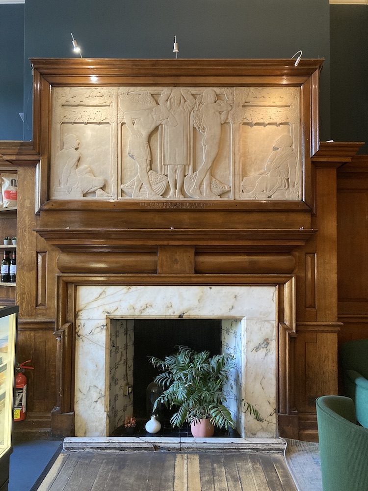 The whole fireplace with the relief as the overmantel